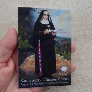 Religiöses katholisches plastifiziertes Kartenschreinreliquiarreliquie des Tuches der seligen Santa Maria Cristina Brando. ( ZZ-18 )
