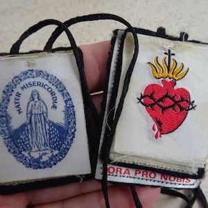 Religious antique catholic scapular reliquary relic shrine cards pictures of Saint Carbel and Mater Miserecorde attached to rope. ( G 3 )