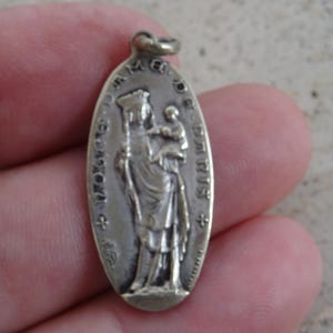Religious antique silvered catholic medal pendant Holy charm medallion of Holy Virgin Mary and the cathedral of Notre Dame de Paris.  M 20