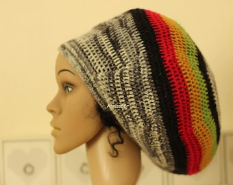 This hat was crocheted with thin woolen yarn in shades of grey with black, red, yellow and green !