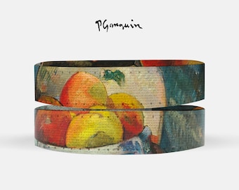 May include: A close-up of a colorful fruit still life painting by Paul Gauguin. The painting features a bowl of oranges, apples, and pears. The painting is printed on a fabric band.