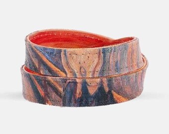 May include: A colorful, patterned leather bracelet with a red interior. The pattern is reminiscent of a famous painting.