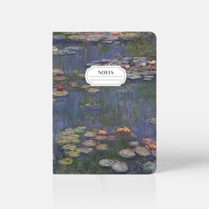 May include: A small notebook with a blue and green water lily design. The cover features a white label with the word "NOTES" printed in black.