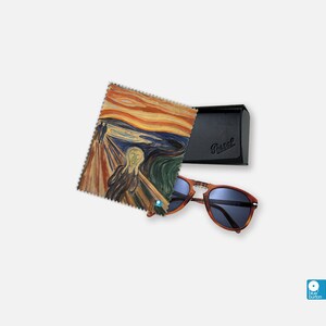 May include: A black case with the word "Persol" printed on it, a pair of brown tortoise shell sunglasses, and a microfiber cleaning cloth with a painting of "The Scream" by Edvard Munch.