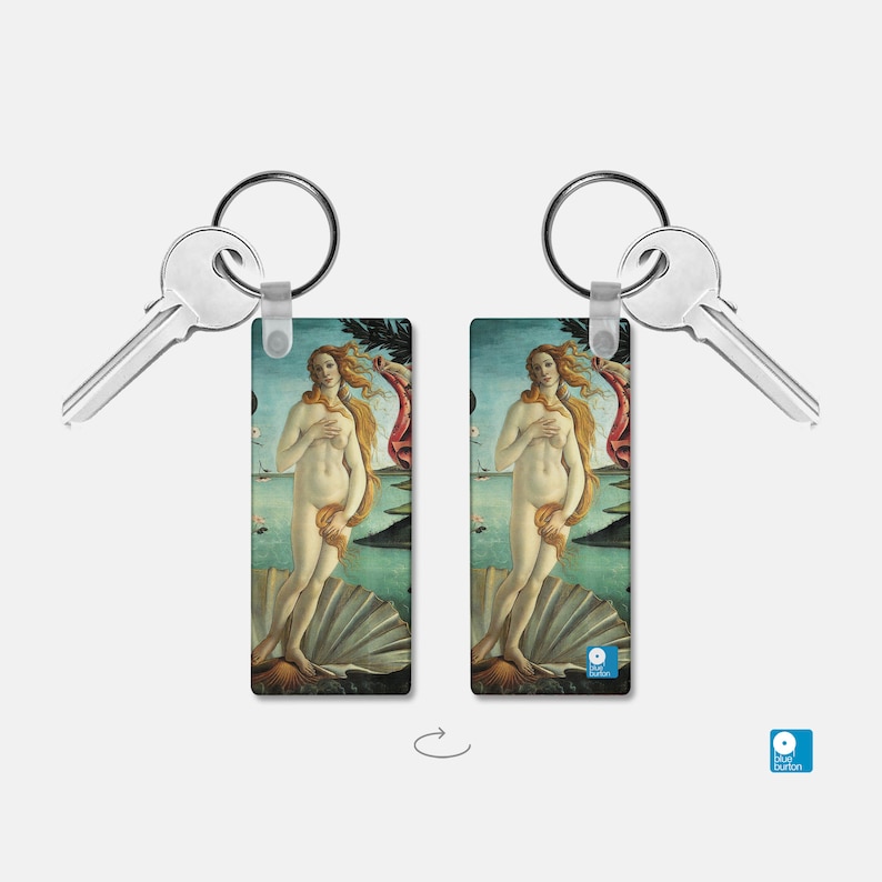 May include: A double-sided keychain featuring a reproduction of the painting "The Birth of Venus" by Sandro Botticelli. The keychain is silver and has a key ring attached.