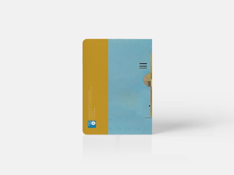 May include: A yellow and blue notebook with a geometric design on the cover. The notebook has a small logo on the bottom left corner.