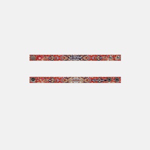 May include: Two red, white, and blue patterned fabric wristbands with silver metal clasps. The top wristband has the text "It really tied the room together" and the bottom wristband has the text "The Dude abides".