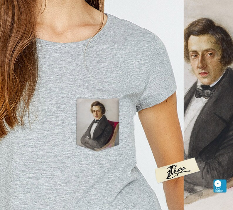 May include: A gray t-shirt with a pocket featuring a portrait of a man in a black suit and white shirt with a bow tie. The man is sitting in a red chair. The t-shirt has a small blue button on the bottom right corner.