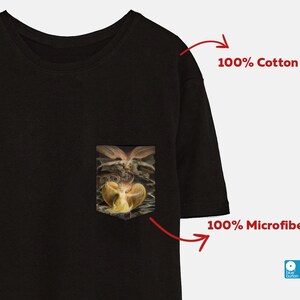 May include: Black t-shirt with a pocket featuring a painting of a winged figure. The t-shirt is made of 100% cotton. 100% Microfiber.