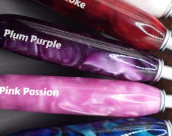 May include: Six different colored pens with names written on them: Snow and Ice, Fire and Smoke, Plum Purple, Pink Passion, Oceans Blue, and Forest Green.