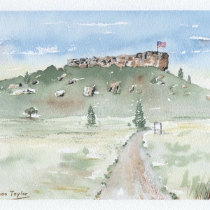 May include: Watercolour painting of a rocky hilltop with an American flag flying on a pole. The hilltop is covered in green grass and there are a few trees in the foreground. A dirt road leads up to the hilltop.