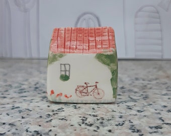 Small Pottery House with Bicycle, Ceramic House with Bicycle Image