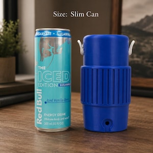 May include: A light blue Red Bull The Iced Edition Sugarfree energy drink slim can next to a blue plastic beverage cooler sleeve with white side tabs. The can features text including The Iced Edition, Sugarfree, Iced Vanilla Berry, and 355 ml (12 fl oz).