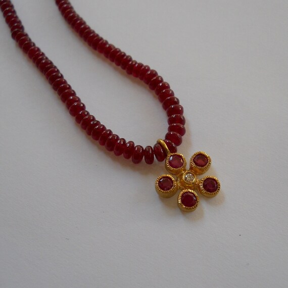 Ruby Beads With a 22K Flower Pendant 