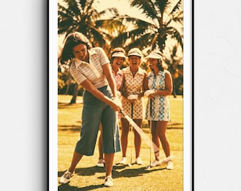 May include: A framed vintage print featuring a group of women playing golf on a sunny day. The woman in the foreground is swinging a golf club. The women are wearing golf attire, including visors and dresses. Palm trees are in the background.