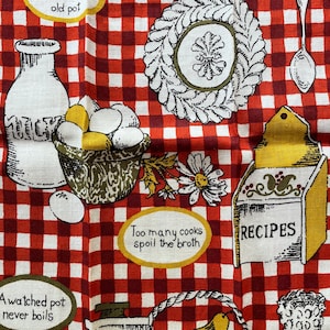 May include: Red and white checkered kitchen towel with various kitchen-themed illustrations and sayings. The sayings include "Good soups are made in an old pot", "A watched pot never boils", and "Too many cooks spoil the broth".