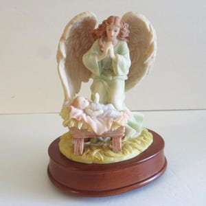 Seraphim Classics Angel, FRANCESCA, Loving Guardian, baby in manger, musical, Angel Figurine, 1993 7.5&quot;, angel music box, seraphim angel