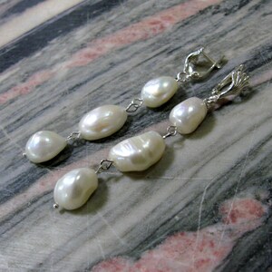 Long nugget pearl earrings natural white baroque pearl drop earrings in sterling silver with shell shaped top image 4