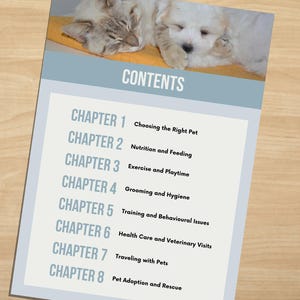 May include: A pet care guide with a light blue border, featuring a sleeping cat and puppy. The guide's contents are listed, including topics like nutrition, exercise, grooming, and pet adoption.