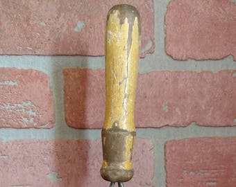vintage BROWN TWISTED POTATOE masher,used rustic old but nice