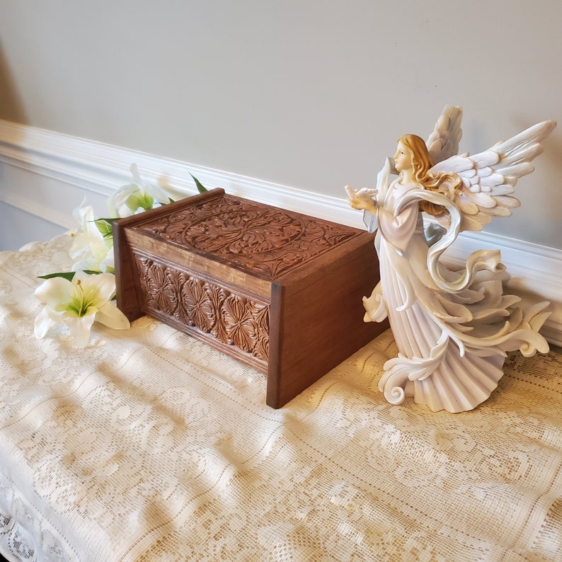 carved wooden urn