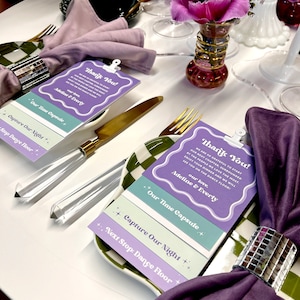 May include: A purple and green checkered plate with a purple napkin and a silver napkin ring. On top of the plate are three cards with the text "Thank You!" and "Our Time Capsule", "Capture Our Night", and "Next Stop: Dance Floor".