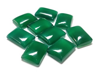 May include: Ten green gemstone cabochons, cut into rectangular shapes, with a polished, glossy finish. The stones are arranged in a loose pile on a white background.