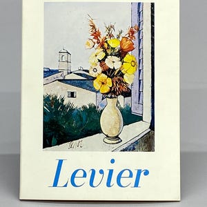 May include: A postcard featuring a painting of a vase of yellow and white flowers on a windowsill. The background shows a cityscape with white buildings and a blue sky. The word "Levier" is printed in blue.