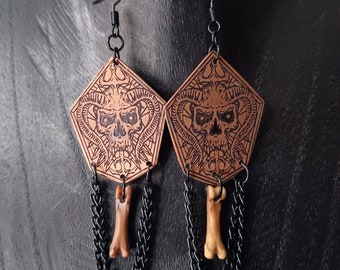 Pendientes de cabeza de diablo con lanzador de pernos óseos, cobre grabado, metalpunk, corteza, metal negro, death metal, fin de los tiempos, gótico, calavera