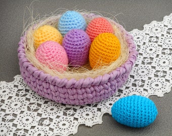 Easter egg basket pastel egg ornaments eggs in the nest Easter basket table centerpiece