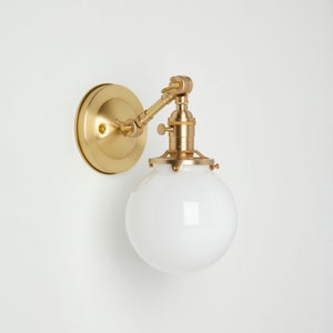 Adjustable arm wall sconce - Hand blown globe - pivot fixture - brass lighting
