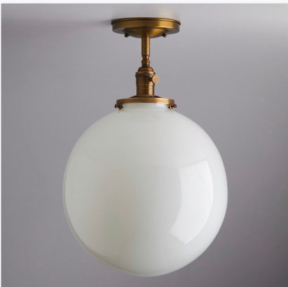 Glass globe semi flush mount deals