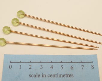 Roman and medieval bronze dress pins with green glass heads set of 4