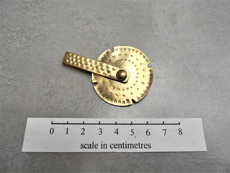 Anglo saxon spinning brass amulet necklace pendant Etsy