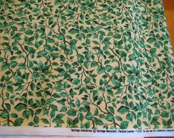 fabric cotton tossed Green Leaves foliage on Yellow background by the yard