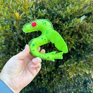 This cryptid's small details on face and body are made with acrylic paint.