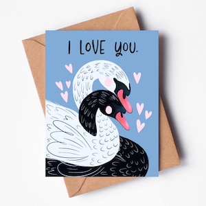 Tarjeta romántica para el día de San Valentín: cisnes blancos y negros "Te amo"