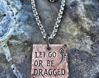 Let go or be dragged - hand stamped - necklace