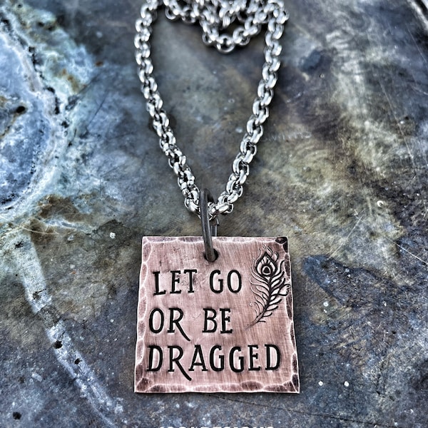 Let go or be dragged - hand stamped - necklace