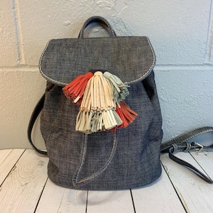 Rebecca Minkoff Sofia Drawstring Backpack Denim Multi-Color Tassels immagine 1