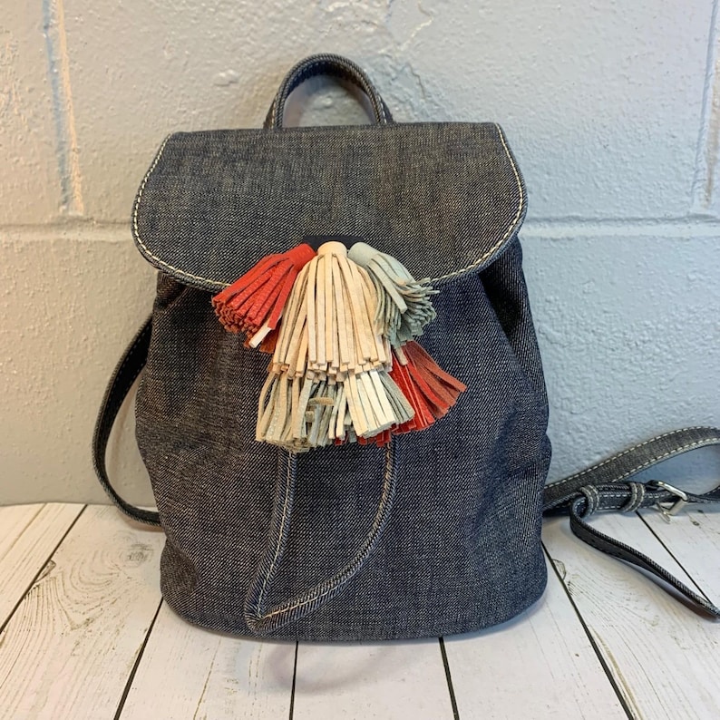 Rebecca Minkoff Sofia Drawstring Backpack Denim Multi-Color Tassels immagine 1