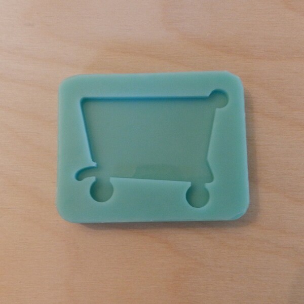 Shopping Cart Silicone Mold for Resin and Epoxy.  Sized for use on Badge Reels.  2" Wide  1/8" (3mm) deep.  Shiny Mold other sizes available