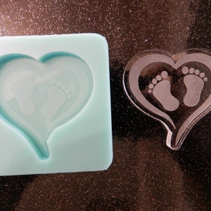 1 1/2" or 2" Etched Feet in Heart Silicone Mold for Resin and Epoxy.  Sized for use on Badge Reels. 1 1/2" or 2" Wide  1/4" deep.