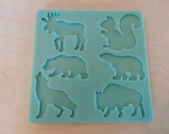 2" Wild Animal Silhouette Silicone Mold for Resin and Epoxy.  Sized for use on Badge Reels. 2" at largest dimension.  1/8" (3mm) deep.