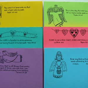 May include: Six colorful cards with angel illustrations and inspirational bible verses. Each card features a different verse and a black and white angel drawing. The cards are yellow, green, blue, pink, purple, and turquoise.