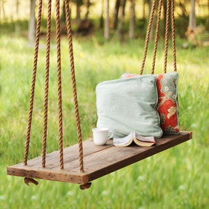Rope tree swing with wooden seat store