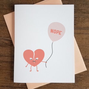 Carte de presse-lettres de coeur cassé de Nope