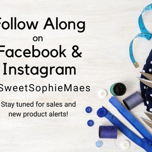 May include: A white wooden surface with sewing supplies, including blue fabric with white polka dots, blue and white buttons, blue zipper, blue and gray thread spools, and two pairs of scissors. The text "Follow Along on Facebook & Instagram @SweetSophieMaes Stay tuned for sales and new product alerts!" is written in black text on the surface.