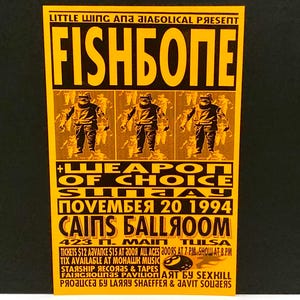 May include: A vintage concert poster with a yellow background and black text. The poster advertises a Fishbone show at Cain's Ballroom on November 20, 1994. The poster features the band's name and the words "Weapon of Choice."