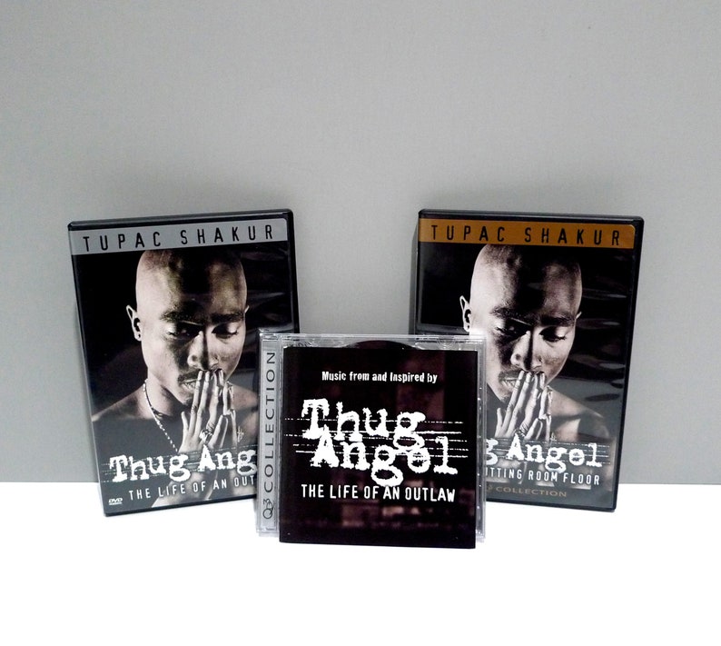 Tupac Shakur Thug Angel 2 DVDs / CD Set / Off The Cutting Room Floor /The Life of an Outlaw / Bonus Features Mohawk Music Record Store image 1